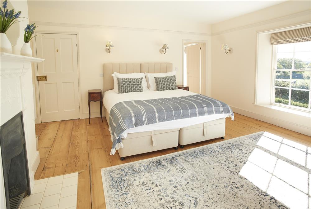 Bedroom one with 6’ super-king zip and link bed and en-suite bathroom at Walesby House, Walesby