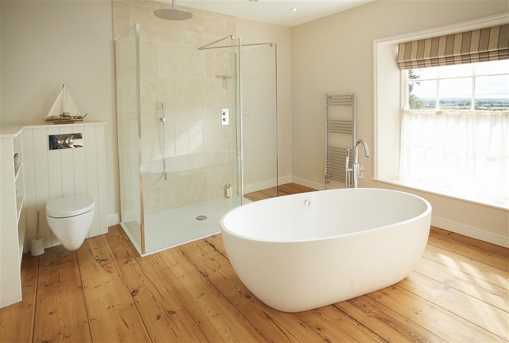 Family bathroom with free-standing bath and separate walk in shower at Walesby House, Walesby
