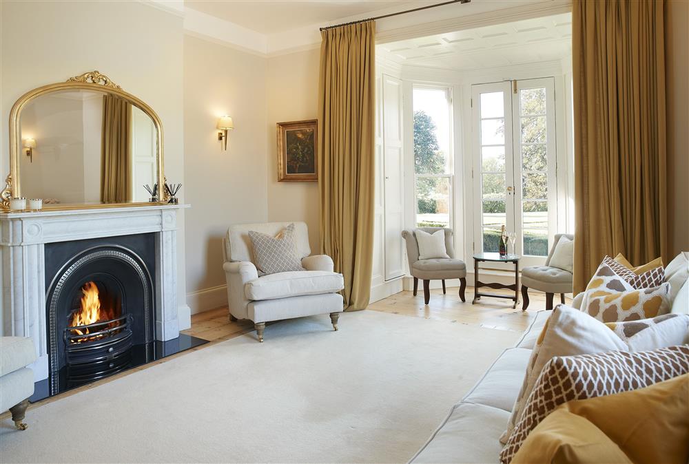 Sitting room with open fire and comfortable seating