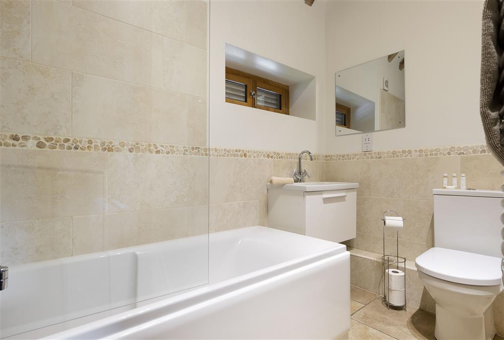 En-suite bathroom with shower over the bath (photo 2) at Wall Hills Barn, Thornbury