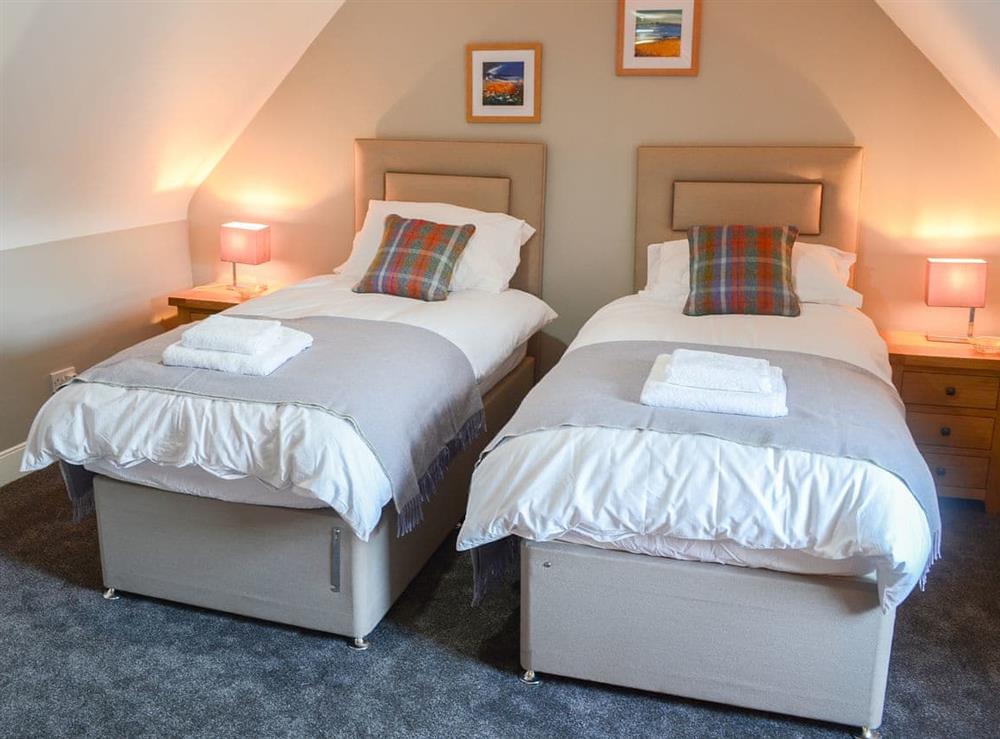 Pretty twin bedded room at Wallace House in Dornoch, near Tain, Sutherland