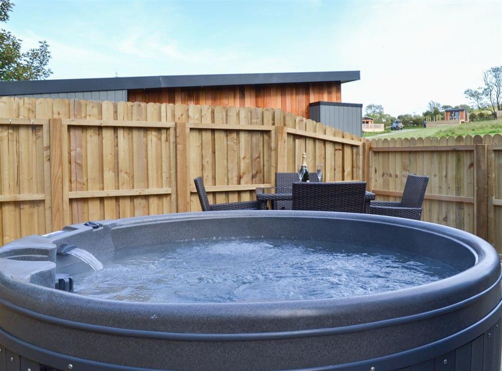 Let the hot tub soak away your aches and pains at Curlew Lodge, 