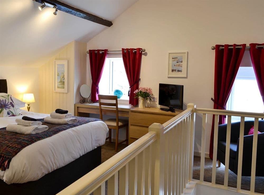 Relaxing bedroom with kingsize bed and beams (photo 2) at Farmhouse Cottage, 