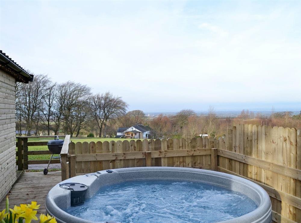 Relaxing hot tub boasting wonderful views at Kestrel Cabin, 