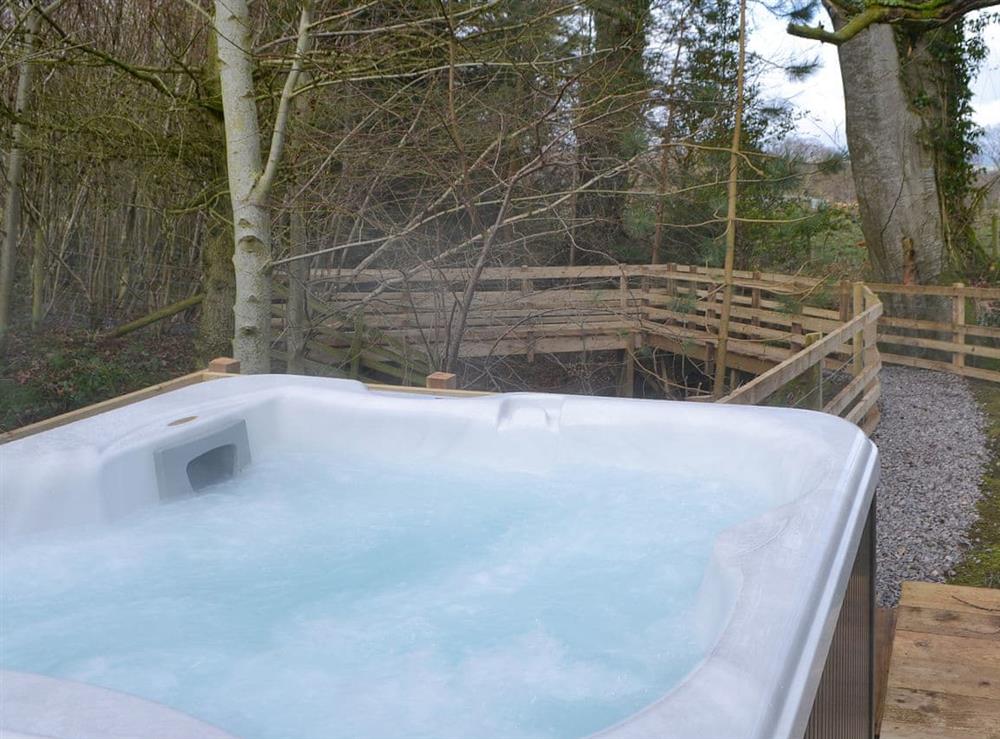 Welcoming private hot tub at Treehouse Cabin, 