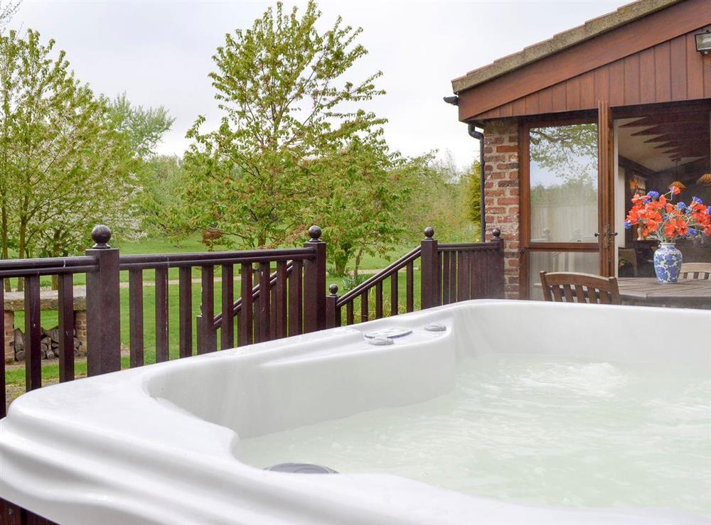Luxurious hot tub at Walled Garden Lodge in Camerton, near Hull, North Humberside