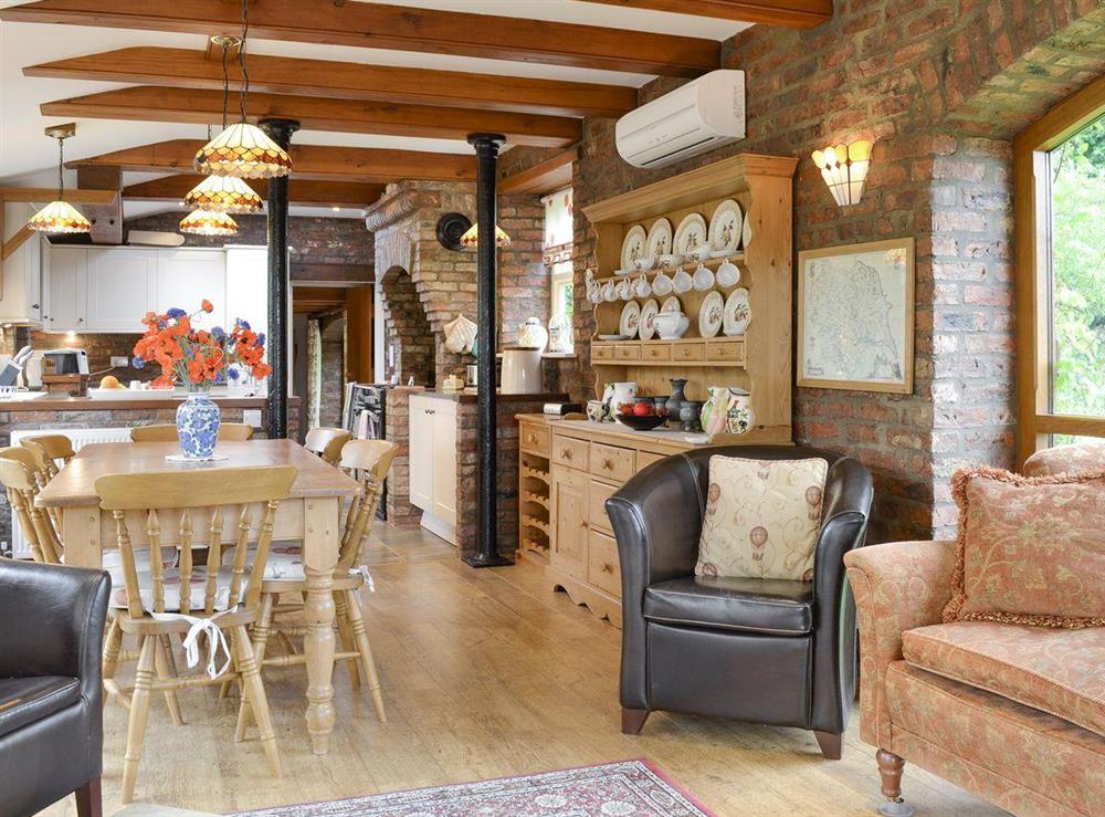 Open-plan second sitting room with integral dining area and kitchen at Walled Garden Lodge in Camerton, near Hull, North Humberside