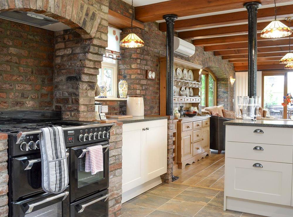 Well-equipped fitted kitchen with range style cooker at Walled Garden Lodge in Camerton, near Hull, North Humberside