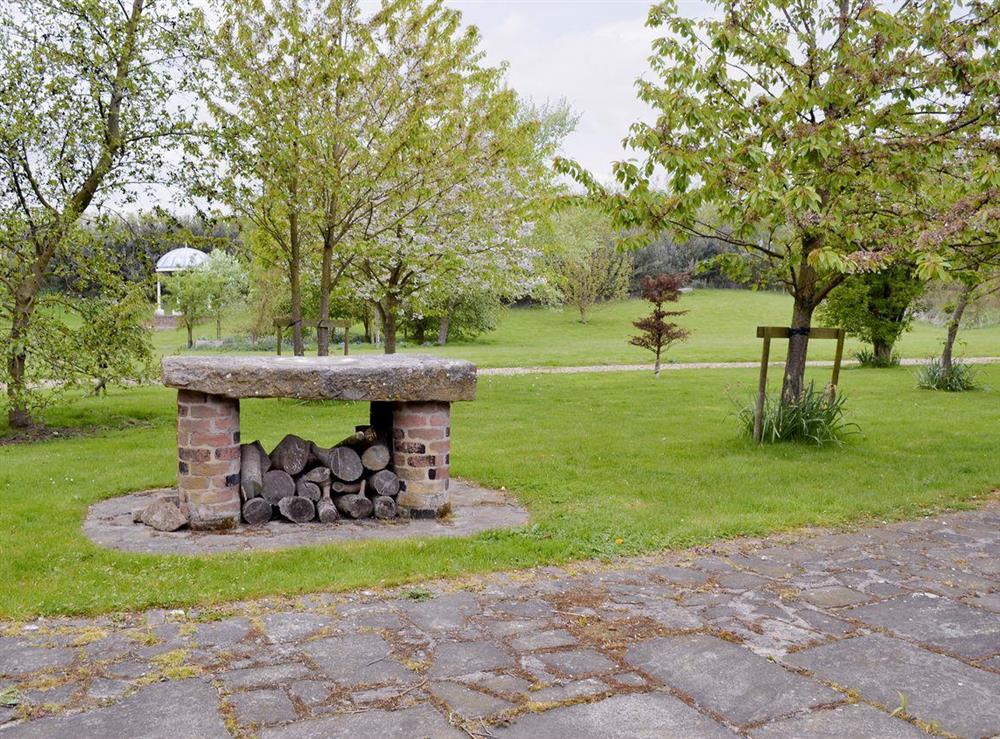 Well-maintained lawned gardens to front of property at Walled Garden Lodge in Camerton, near Hull, North Humberside