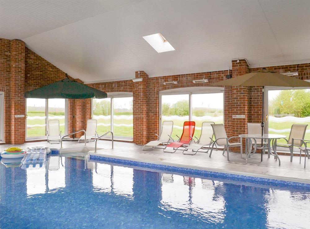 Shared indoor swimming pool at Aimmees Lodge, 