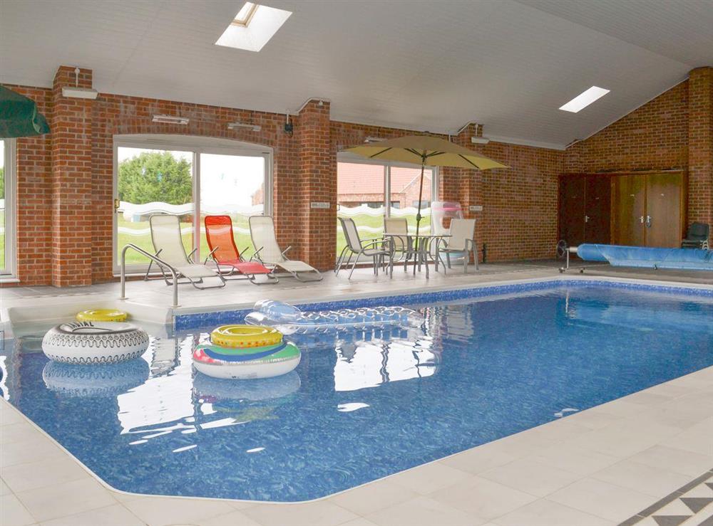 Luxurious shared indoor swimming pool at Carp Cottage, 
