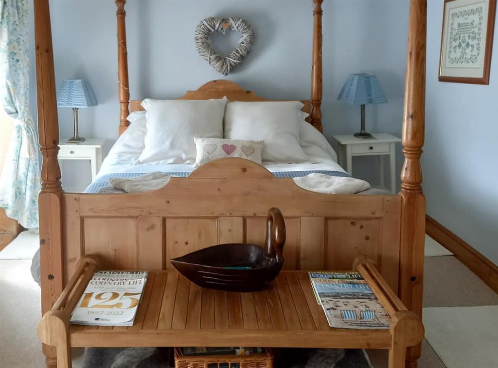 Four Poster bedroom at Walnut Cottage in Wells-next-the-Sea, Norfolk