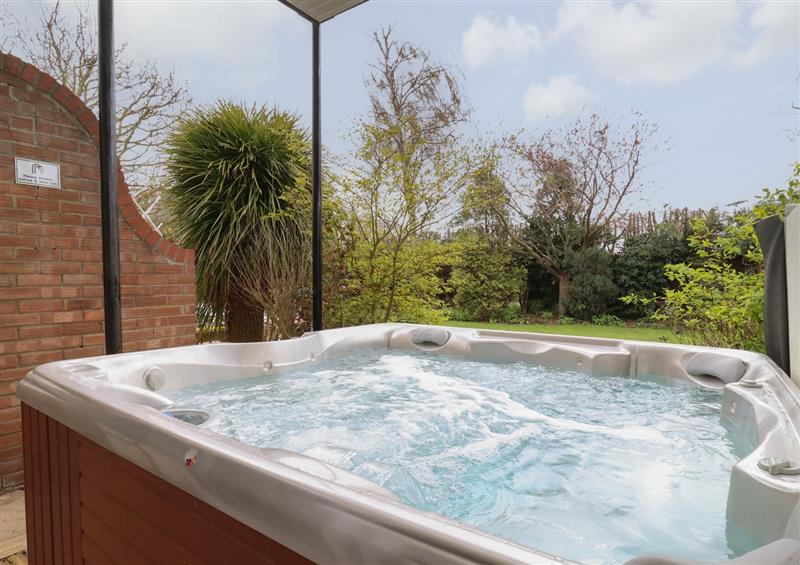 Relax in the hot tub at Walnut House, Oulton Broad near Lowestoft