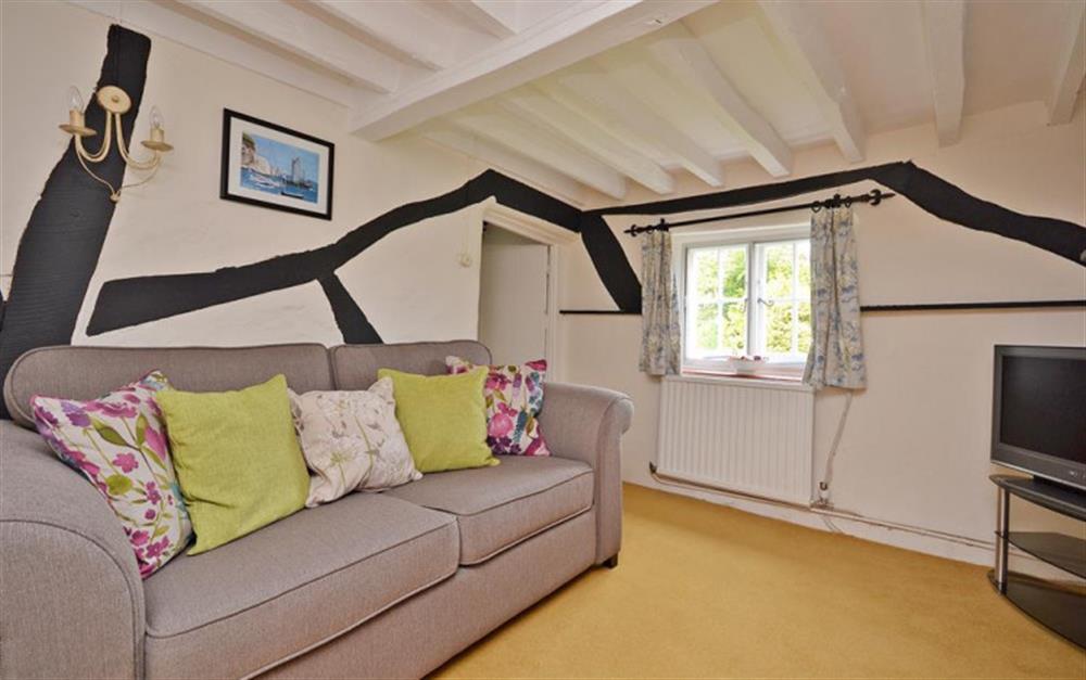Small snug with TV and sofa seating up to three at Walnut Tree Cottage in Tiptoe