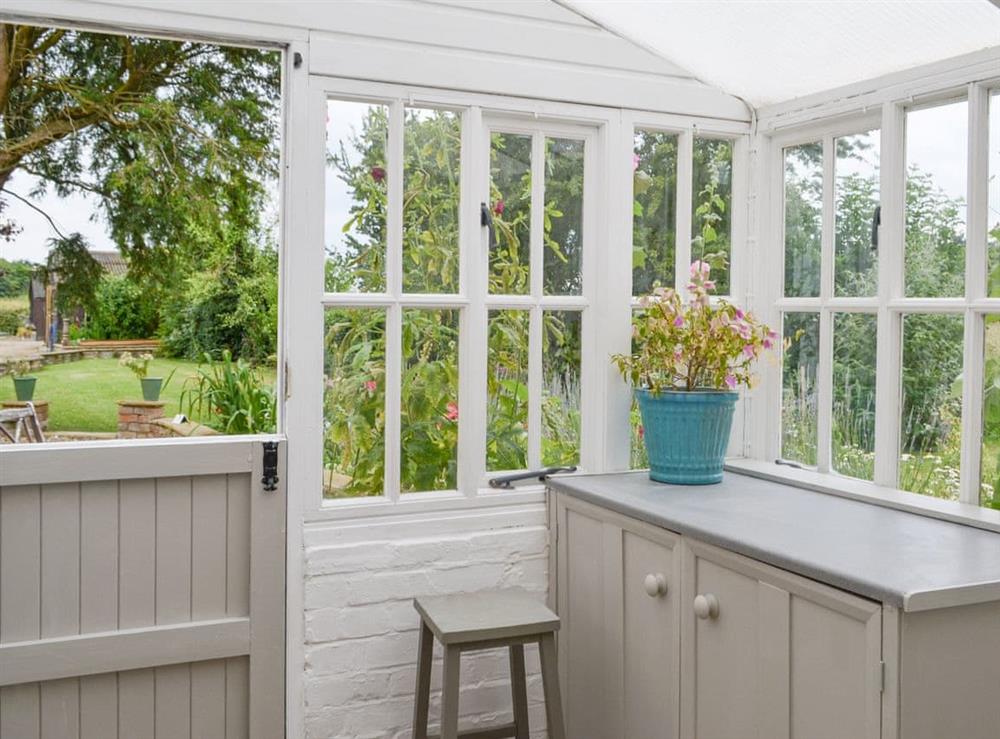 Garden room with lovely views over the garden at Walnut Tree House in Tilney St Lawrence, near King’s Lynn, Norfolk