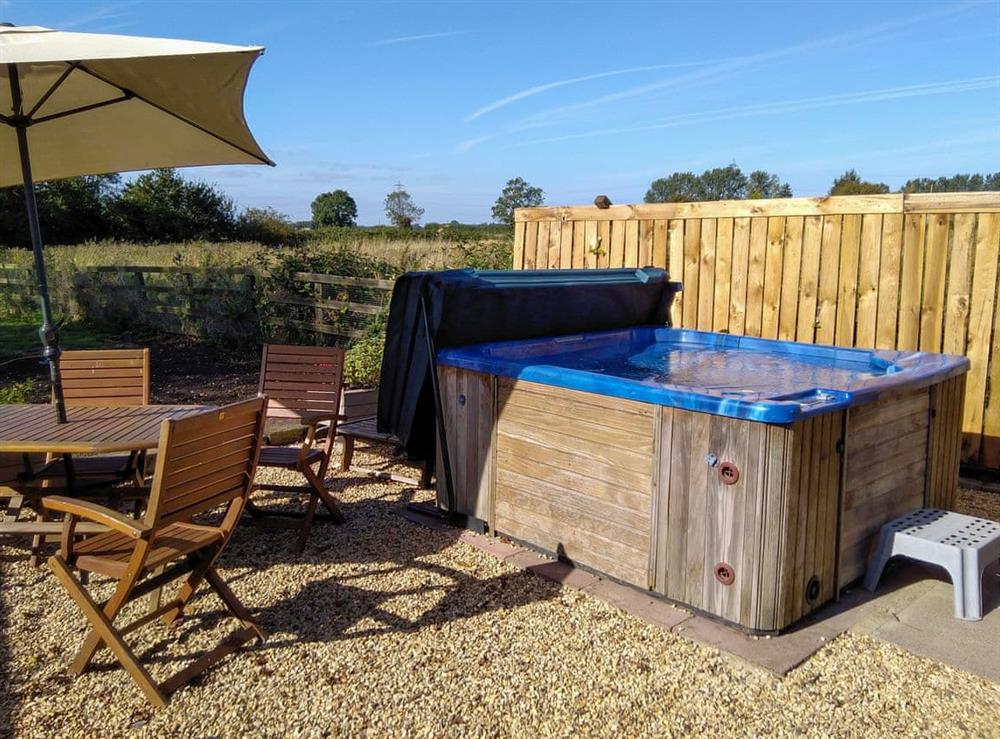 Large hot tub with views of the paddock and open fields (photo 2) at Walnut Tree House in Tilney St Lawrence, near King’s Lynn, Norfolk