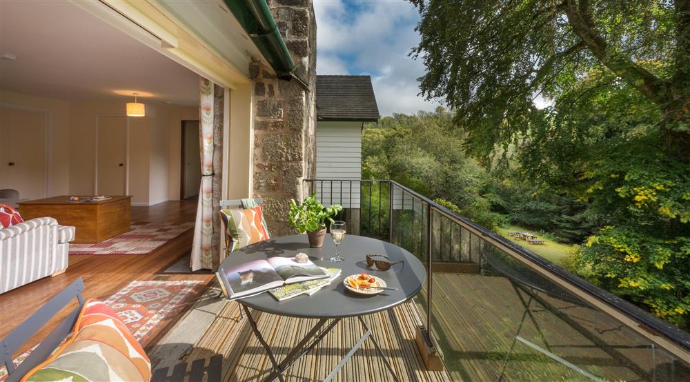 The exterior dining area on the balcony at Warcleave Cottage in Newton Abbot, Devon