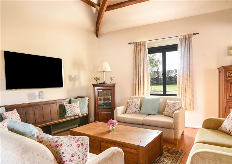 Enjoy the living room at Ware Barn Cottage, Ware near Lyme Regis