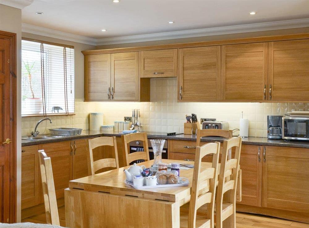 Well-equipped kitchen with dining area at Waren View in Bamburgh, Northumberland., Great Britain
