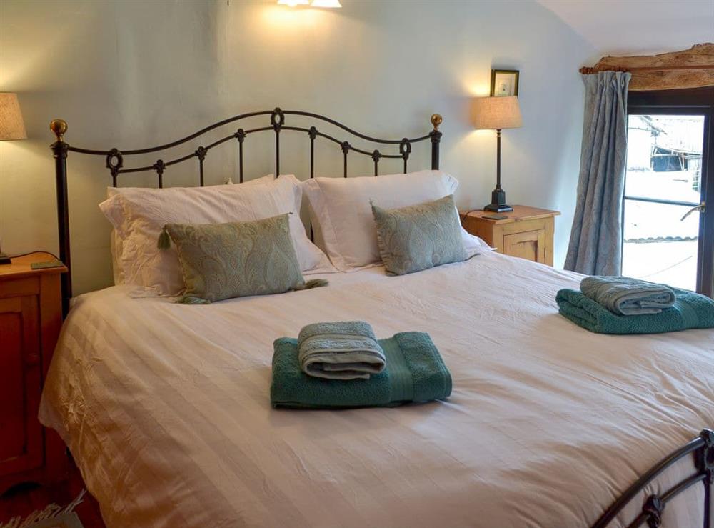 Comfortable king sized bedroom at Warmhill Farmhouse in Newton Abbot, Devon