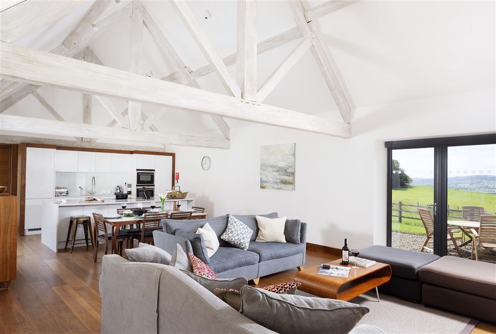 Open plan sitting room, dining area and kitchen at Wassell Barn, Craven Arms