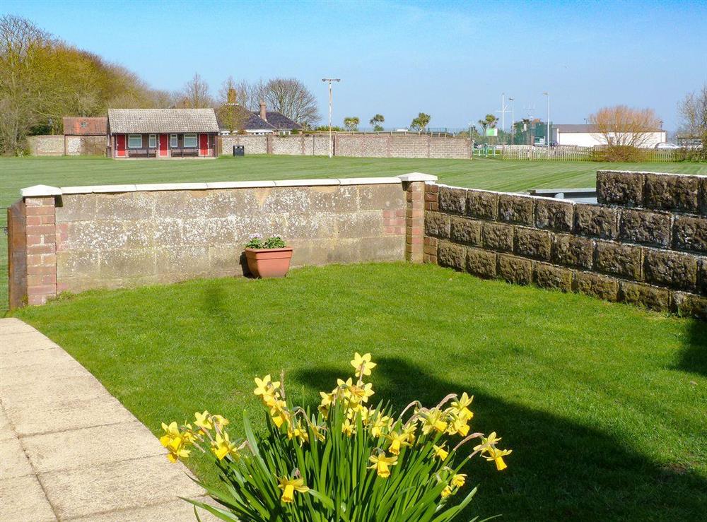 Back garden leads straight onto Gold Park and the beach beyond at Watchkeepers Cottage in Mundesley, Norfolk