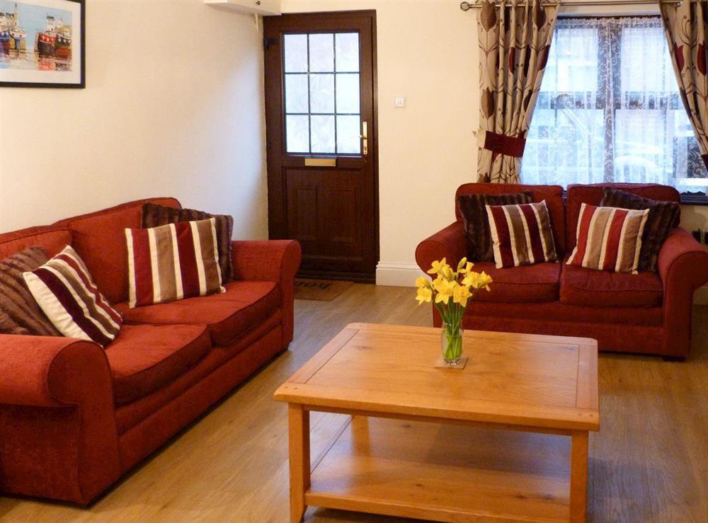 Warm and welcoming living room at Watchkeepers Cottage in Mundesley, Norfolk