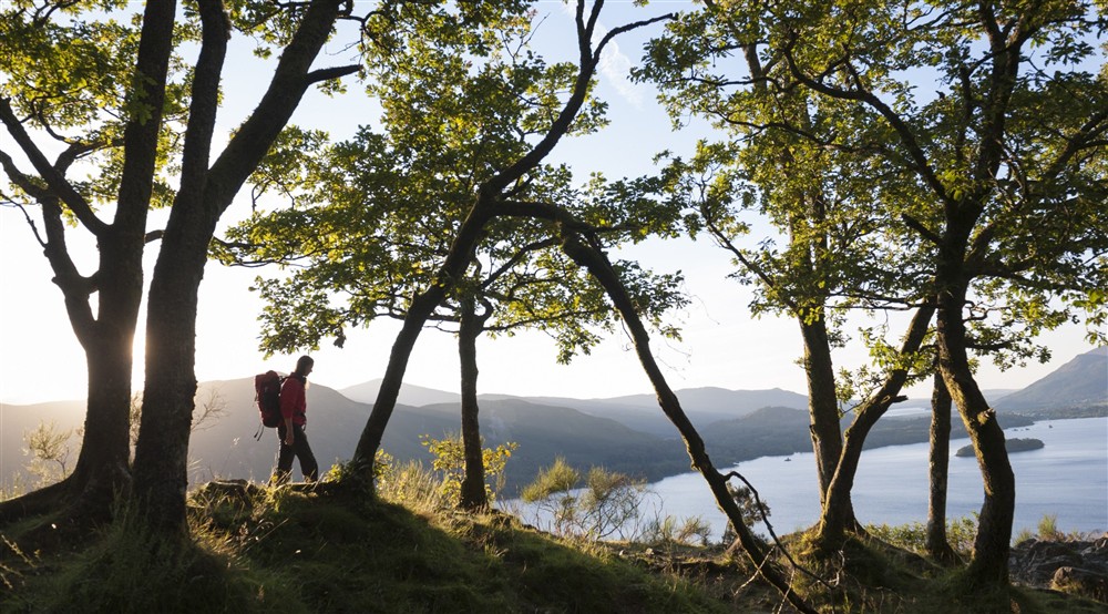 A walker takes in the scenery at Watendlath Bothy in Keswick, Cumbria