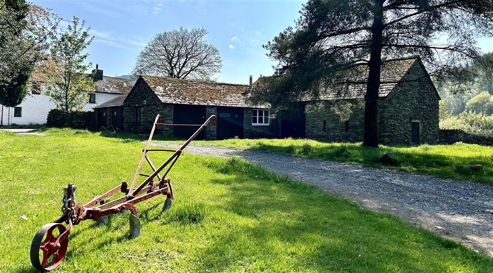 The path and grassy area leading past Watendlath Bunkhouse, Cumbria at Watendlath Bothy in Keswick, Cumbria