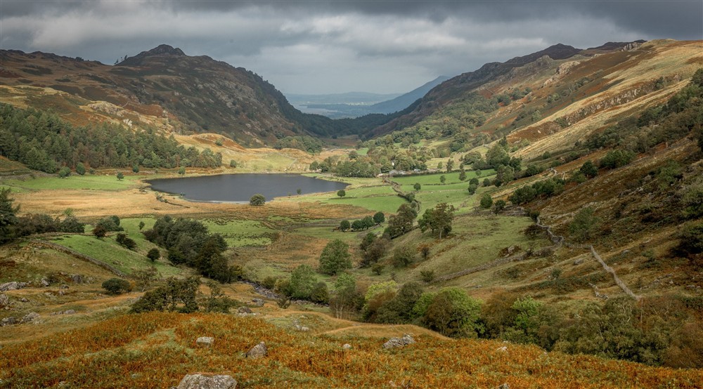 View over Watendlath Tarn in autumn, surrounded by mountains, Borrowdale, the Lake District at Watendlath Bothy in Keswick, Cumbria