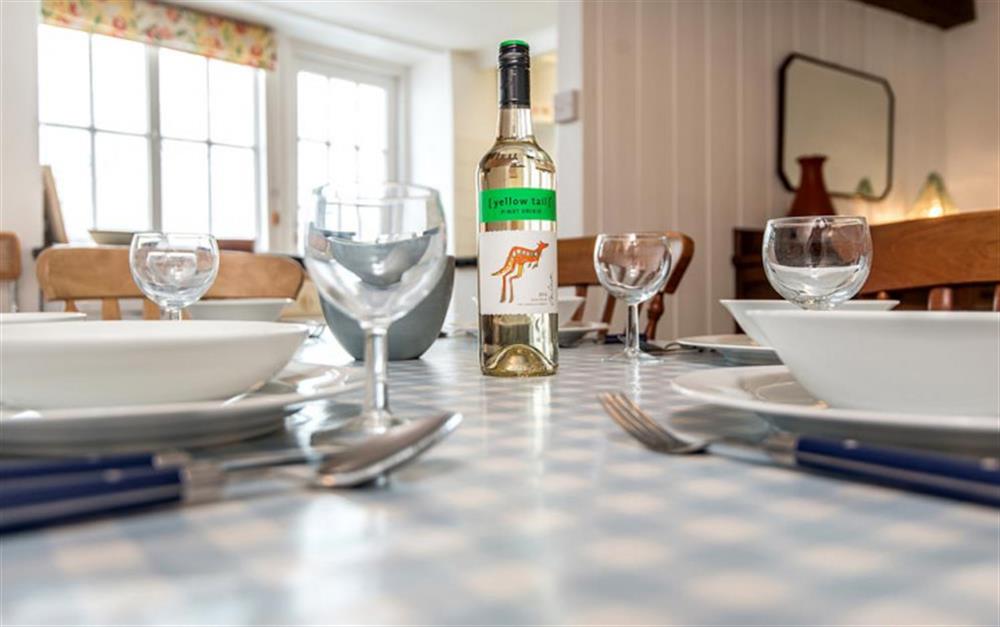 Family diners at the table at Water Cottage in Lyme Regis