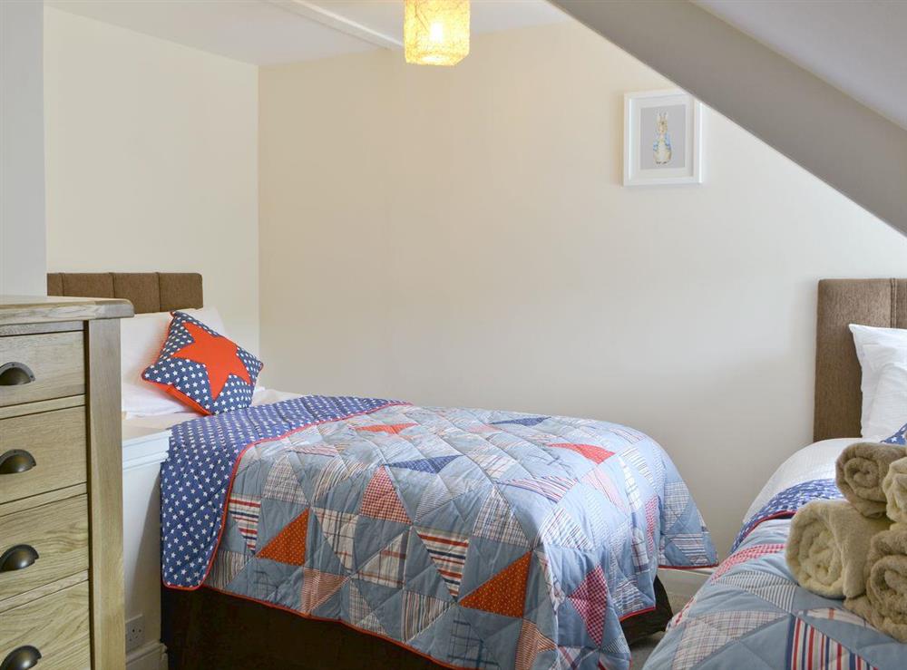 Comfortable twin bedroom at Water Howes Cottage in Ambleside, Cumbria