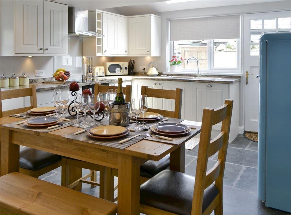 Convenient dining area within kitchen and dining room at Water Howes Cottage in Ambleside, Cumbria