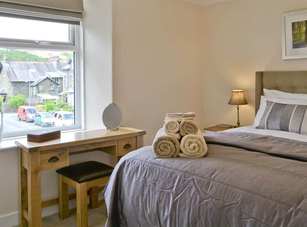 Master bedroom with views over town and country at Water Howes Cottage in Ambleside, Cumbria