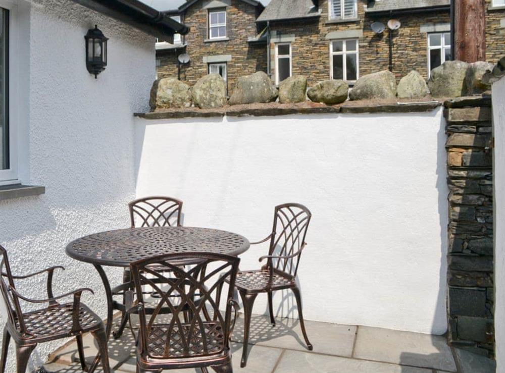 Sitting out furniture in enclosed rear courtyard at Water Howes Cottage in Ambleside, Cumbria