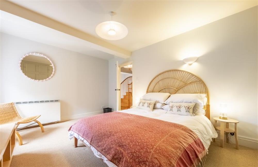 Master bedroom with king-size bed at Water Mill House, Burnham Overy Staithe near Kings Lynn