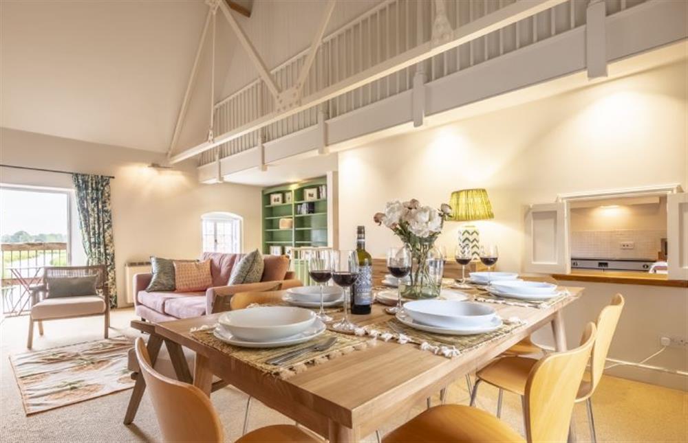 The dining area has a serving hatch to the kitchen at Water Mill House, Burnham Overy Staithe near Kings Lynn