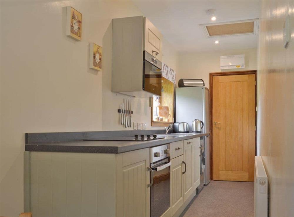 Galley style kitchen at Waterfall Cottage in Lumsdale, Tansley Wood, near Matlock, Derbyshire