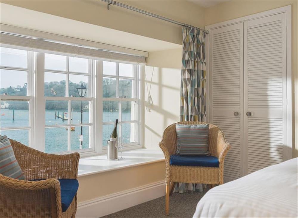 Magnificent views over the quay and harbour fom the double bedroom at Waterfront Apartment in Fowey, Cornwall