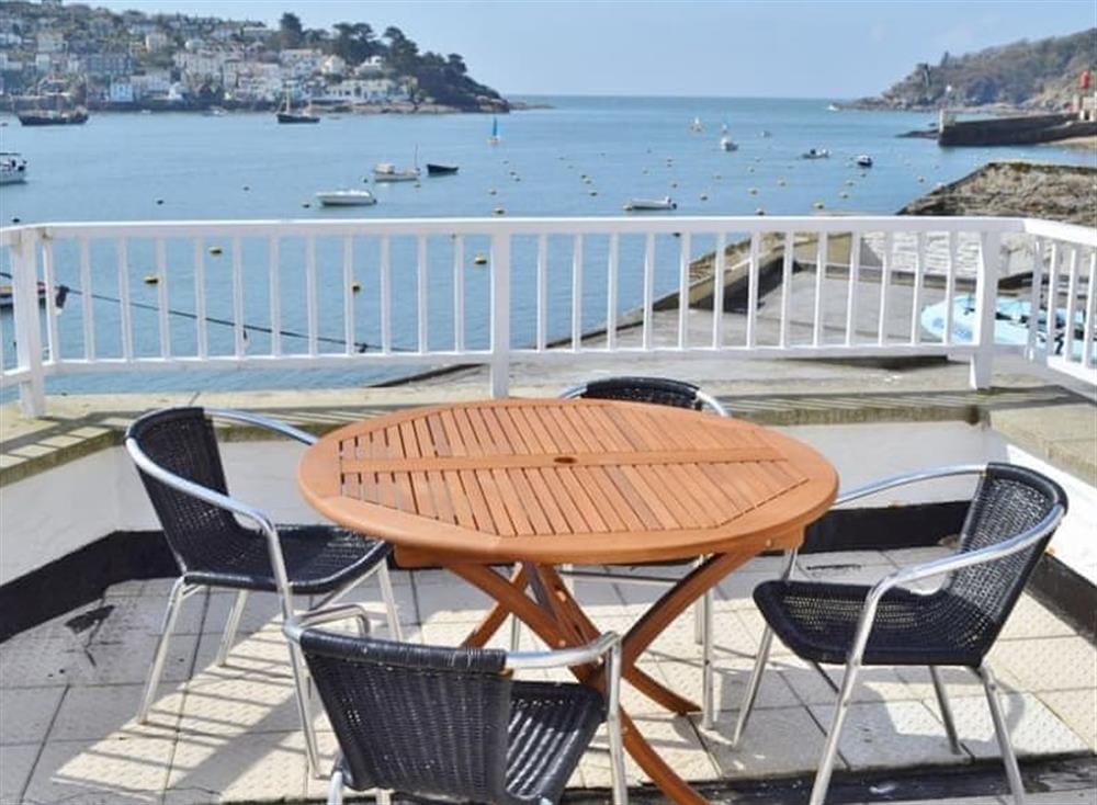 The balcony enjoys a sunny due south aspect and has a particularly stunning outlook over the harbour and the open sea at Waterfront Apartment in Fowey, Cornwall