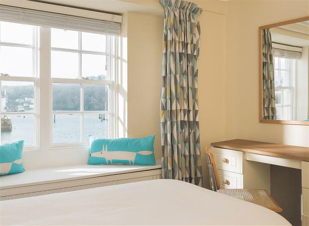The twin bedroom has fabulous views over the town quay at Waterfront Apartment in Fowey, Cornwall