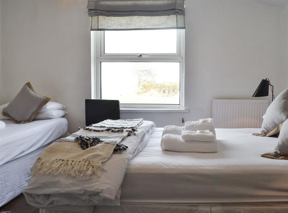 Double bedroom with additional single bed at Waterfront Beach House in Criccieth, near Porthmadog, Gwynedd