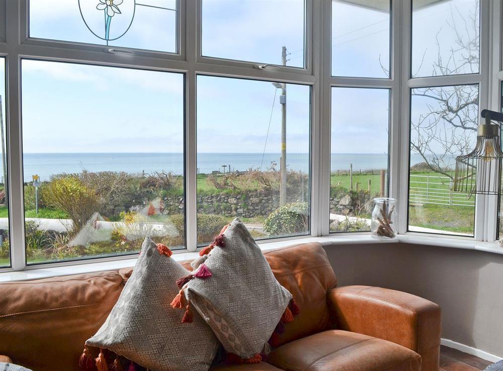 Living room with sea view at Waterfront Beach House in Criccieth, near Porthmadog, Gwynedd