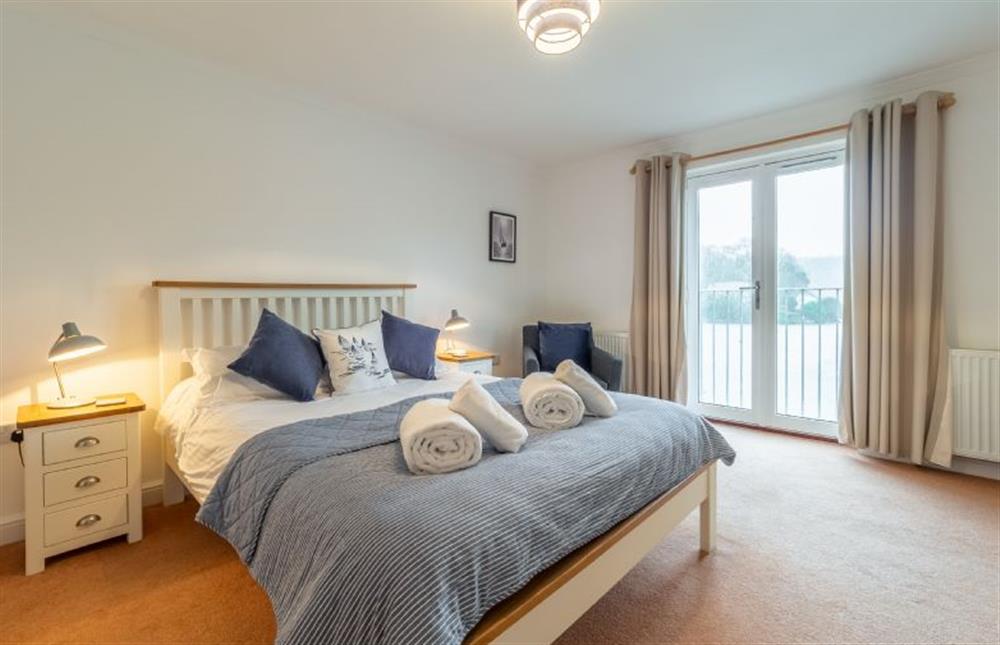 Bedroom one with Juliet balcony and stunning marina views at Waterfront House, Malpas, Truro 