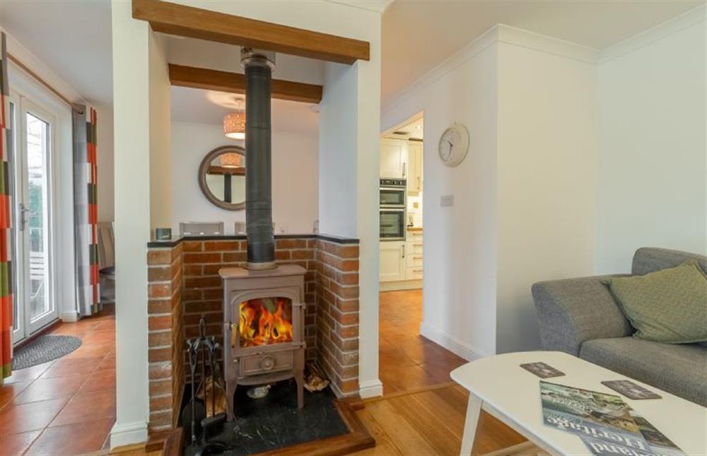 Cosy sitting room with wood burning stove at Waterfront House, Malpas, Truro 