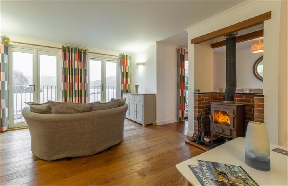 Sitting room with doors leading to balcony at Waterfront House, Malpas, Truro 