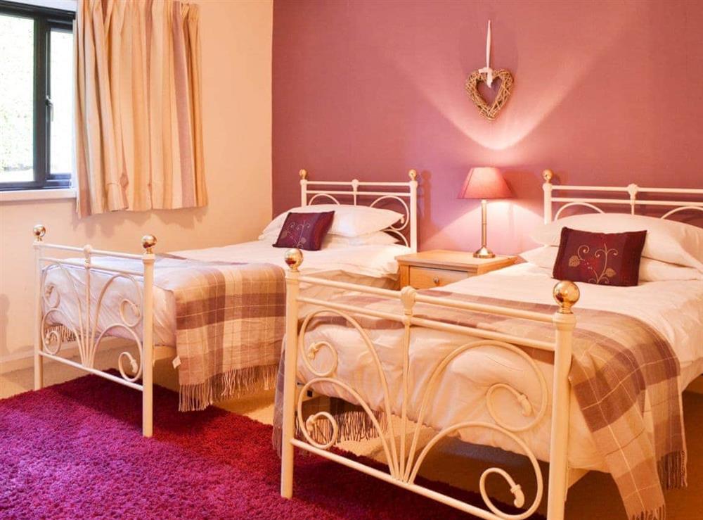 Delightful twin bedroom with antique style beds at Waterhead Studio in Nr. Ambleside, Cumbria