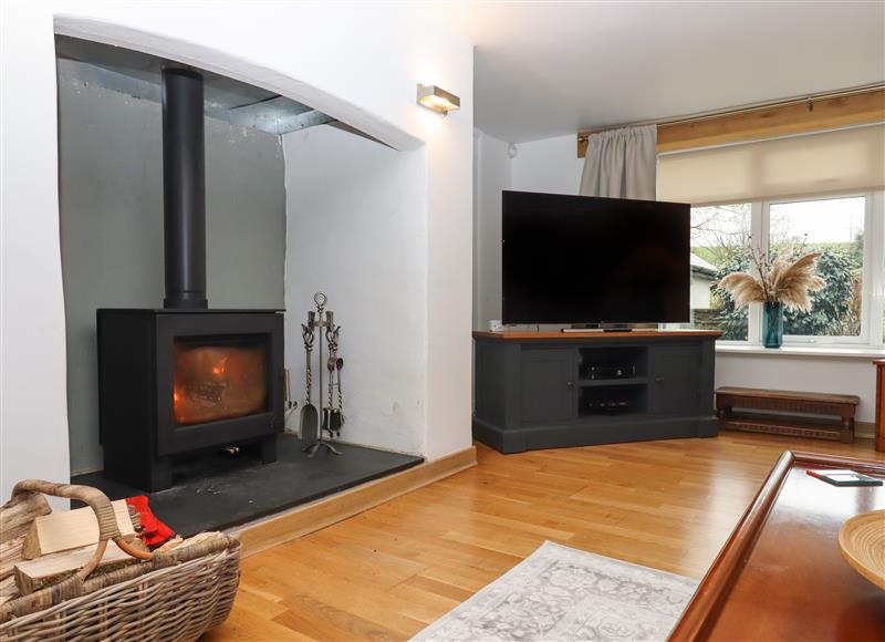 Relax in the living area at Waterland Farmhouse, Bradworthy