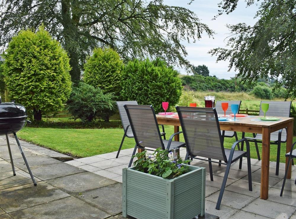Inviting patio area with garden furniture at Waterloo Farm House in Waterloo, near Dunkeld, Perthshire