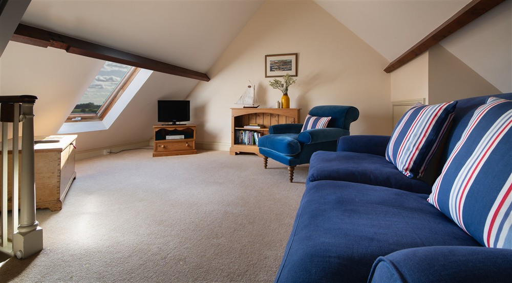 The gallery sitting room at Watermill Apartment in Burnham-overy-staithe, Norfolk